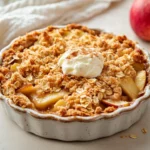 Delicious Apple Crumble With Oats In A Rustic Dish, Topped With Creamy Yogurt And A Sprinkle Of Cinnamon