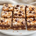 Plate Of Gluten Free Hello Dolly Squares With Layers Of Chocolate And Toasted Coconut, Warm And Inviting