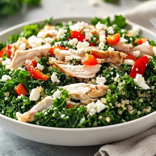 Quinoa Kale Salad With Chicken: A Healthy, Flavorful Recipe 2 Quinoa Kale Salad With Chicken Topped With Feta Cheese And Drizzled With Dressing In A White Bowl