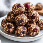 Plate Of Anti-Inflammatory Energy Balls Drizzled With Dark Chocolate And Sprinkled With Cinnamon