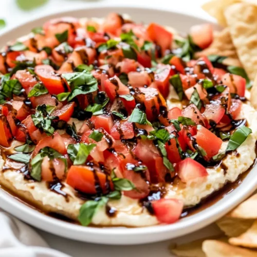 Bruschetta Dip Appetizer: Easy, Fresh, And Irresistible Starter 2 Bruschetta Dip Appetizer Garnished With Fresh Basil And Tomatoes On A White Platter With Pita Chips