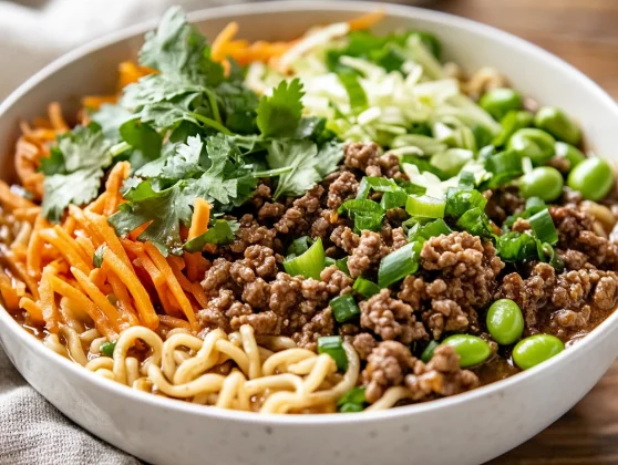 Healthy Crockpot Beef Ramen Recipe Packed With Flavor 2 Bowl Of Crockpot Beef Ramen Garnished With Fresh Cilantro And Green Onions On A Wooden Table