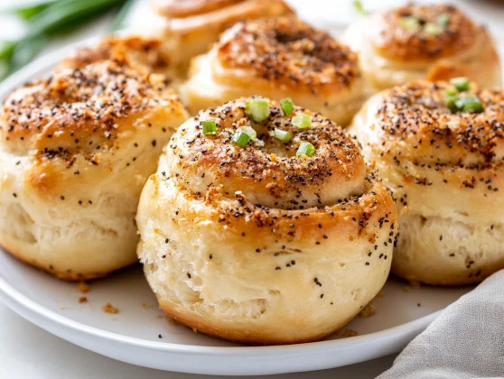 Soft And Savory Everything Bagel Cream Cheese Rolls Recipe 2 Everything Bagel Cream Cheese Rolls On A White Plate, Garnished With Scallions And Everything Bagel Seasoning