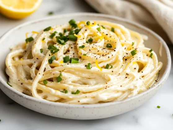 Lemon Ricotta Spaghettoni: The Perfect One-Pot Pasta Dish 2 Creamy Lemon Ricotta Spaghettoni In A White Bowl Garnished With Scallions And Cracked Pepper