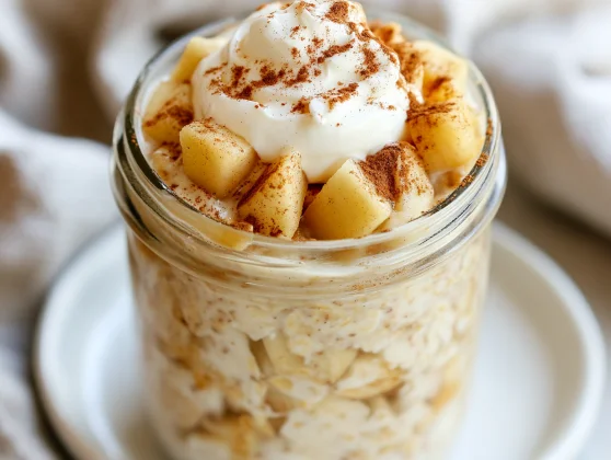 Apple Pie Overnight Oats - A Healthy &Amp; Delicious Breakfast Idea 2 Bowl Of Apple Pie Overnight Oats Topped With Greek Yogurt And Cinnamon Apple Chunks, Served On A White Plate
