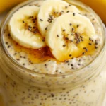 Creamy Banana Chia Pudding In A Glass Jar Topped With Banana Slices And Maple Syrup