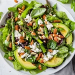 Best Spring Salad With Asparagus, Avocado, And Goat Cheese On A White Plate, Garnished With Sunflower Seeds And Basil