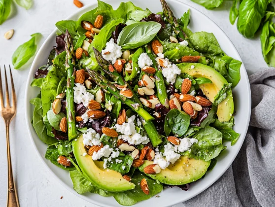 Best Spring Salad With Asparagus, Avocado, And Goat Cheese On A White Plate, Garnished With Sunflower Seeds And Basil