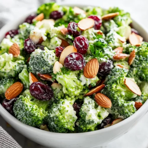 Healthy Broccoli Cranberry Salad With Creamy Greek Yogurt Dressing 2 Healthy Broccoli Cranberry Salad In A White Bowl, Topped With Fresh Herbs And Creamy Dressing