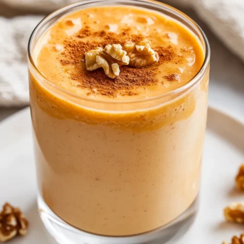Carrot Cake Smoothie: A Healthy And Delicious Breakfast Treat 2 Creamy Carrot Cake Smoothie In A Clear Glass, Garnished With Crushed Walnuts And A Sprinkle Of Cinnamon