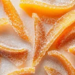 Plate Of Healthier Candied Orange Peels With A Chocolate Drizzle, Highlighting Their Glossy Texture And Vibrant Color