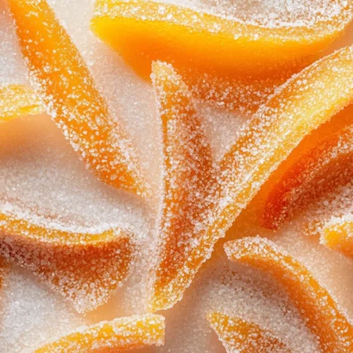 Plate Of Healthier Candied Orange Peels With A Chocolate Drizzle, Highlighting Their Glossy Texture And Vibrant Color