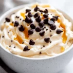 Healthy Cookie Dough With Greek Yogurt Served In A White Bowl, Topped With Dark Chocolate Chips And Honey Drizzle