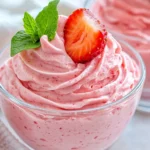 Close-Up Of High-Protein Strawberry Mousse In A Glass Bowl Topped With Whipped Cream And Fresh Strawberries