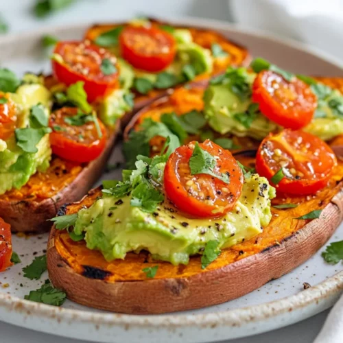 How To Make Sweet Potato Toast: A Healthy Breakfast Idea 2 Delicious How To Make Sweet Potato Toast Topped With Smashed Avocado And Cherry Tomatoes On A White Plate