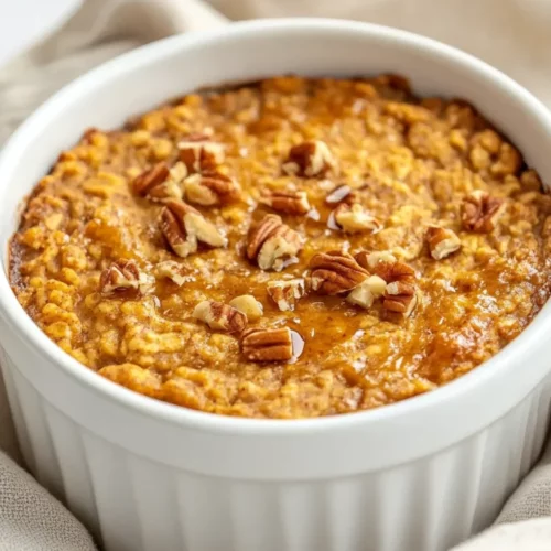 Pumpkin Baked Oatmeal: A Healthy &Amp; Easy Breakfast Recipe 2 Bowl Of Pumpkin Baked Oatmeal Drizzled With Maple Syrup And Topped With Walnuts On A Simple Kitchen Towel.