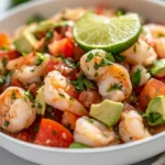 Colorful Shrimp Ceviche In A White Bowl Garnished With Cilantro And Lime Zest