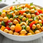 Colorful 10-Minute Curried Chickpea Salad In A White Bowl, Topped With Cilantro And Green Onions