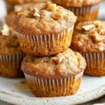 Freshly Baked Apple Banana Carrot Muffins On A Rustic Plate, Drizzled With Honey And Garnished With Walnuts