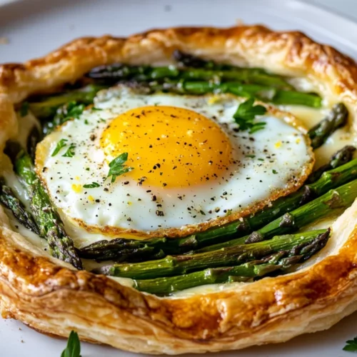 Asparagus Puff Pastry Tart With Eggs: A Healthy &Amp; Delicious Recipe 2 Asparagus Puff Pastry Tart With Eggs On A White Plate, Garnished With Fresh Herbs And Lemon Zest