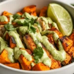 Avocado Mojo Bowls With Roasted Sweet Potatoes And Chicken, Drizzled With Avocado Sauce And Garnished With Cilantro.