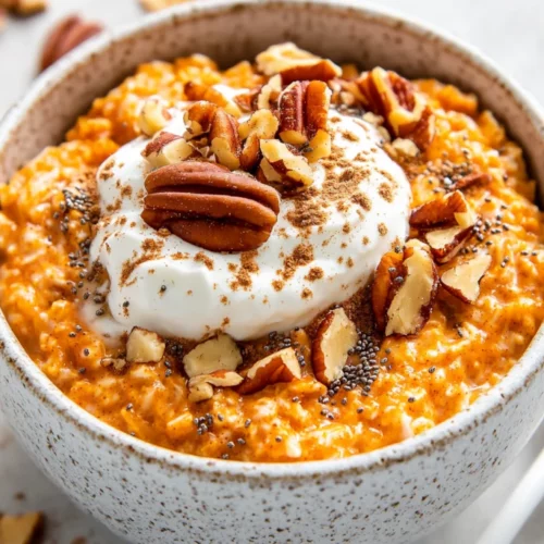 Delicious And Healthy Carrot Cake Overnight Oats For Busy Mornings 2 Delicious Carrot Cake Overnight Oats Topped With Yogurt, Pecans, And Maple Syrup In A White Bowl