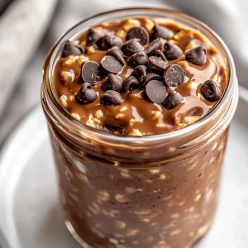 Chocolate Peanut Butter Overnight Oats: A Healthy, Delicious Breakfast 2 Glass Jar Of Chocolate Peanut Butter Overnight Oats Topped With Mini Chocolate Chips On A White Plate