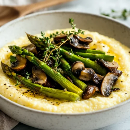 Creamy Polenta With Spring Vegetables: A Healthy Comfort Food Classic 2 Creamy Polenta With Spring Vegetables In A White Bowl, Topped With Asparagus And Mushrooms, Garnished With Fresh Thyme