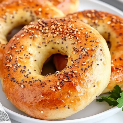 Easy Homemade Bagels: No Yeast, Quick &Amp; Healthy Recipe 2 Golden Easy Homemade Bagels On A White Plate, Topped With Everything Seasoning And Garnished With Parsley