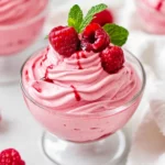 Delicious Easy Raspberry Mousse Topped With Raspberry Sauce And Fresh Mint In A Clear Glass Cup