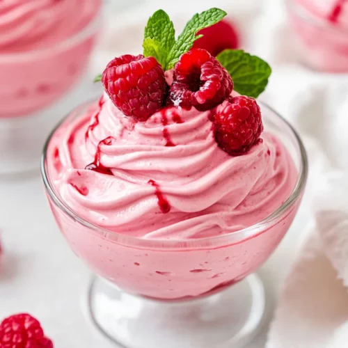 Delicious Easy Raspberry Mousse Topped With Raspberry Sauce And Fresh Mint In A Clear Glass Cup