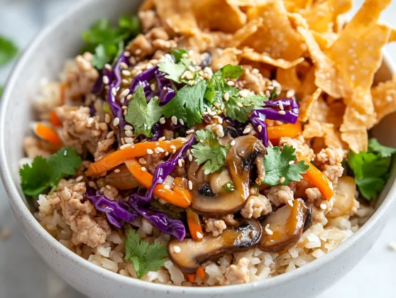 Healthy Egg Roll In A Bowl – Quick &Amp; Easy Dinner Recipe 2 Colorful Egg Roll In A Bowl With Ground Chicken, Coleslaw, Served On A White Plate And Garnished With Cilantro.