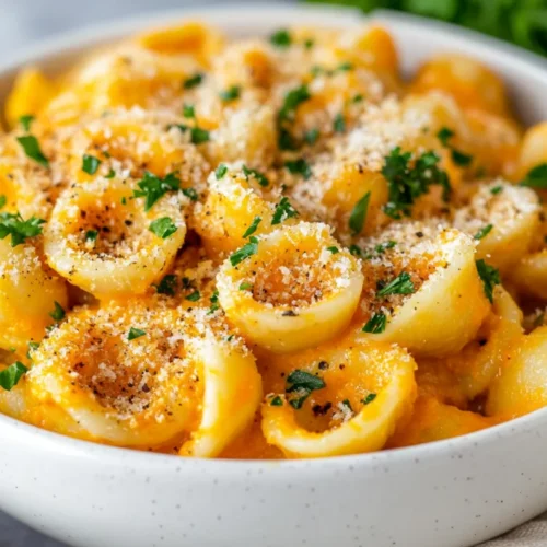 Orecchiette Pasta With Carrot Sauce - A Healthy Vegan Delight 2 Creamy Orecchiette Pasta With Carrot Sauce And Fresh Parsley In A White Bowl, Garnished With Breadcrumbs