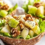 Colorful Pear Waldorf Salad Pitas Filled With Pears, Grapes, And Walnuts On A White Plate With Greens