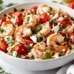 Shrimp Orzo Feta Bowl With Fresh Shrimp, Cherry Tomatoes, And Crumbled Feta Garnished With Cilantro