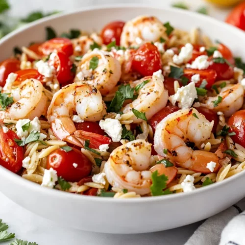 Shrimp Orzo Feta Bowl With Fresh Shrimp, Cherry Tomatoes, And Crumbled Feta Garnished With Cilantro
