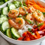 Fresh Spring Roll Bowl Recipe With Rice Noodles, Veggies, Shrimp, And Herbs Topped With Sweet Garlic Lime Sauce