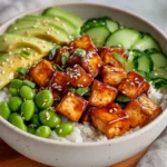 Vibrant Teriyaki Tofu Donburi Bowl With Glazed Tofu, Rice, Cucumber, And Avocado Slices