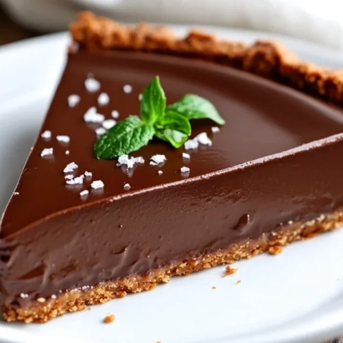 The Best Vegan Chocolate Pie – Rich, Easy, And Healthy! 2 Vegan Chocolate Pie Topped With Sea Salt And Mint Leaves, Served On A White Plate With A Golden Crust