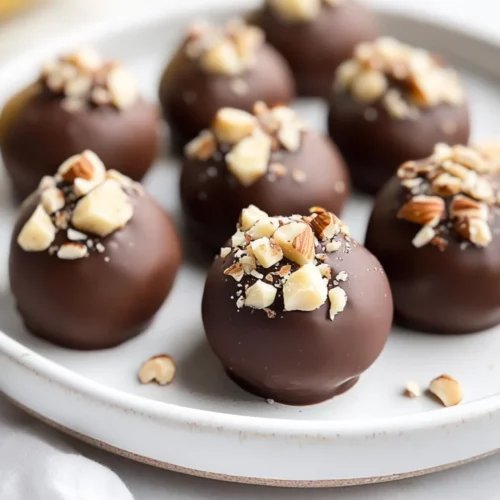 Banana Chocolate Hazelnut Bites - A Healthy Energy Snack 2 Plate Of Banana Chocolate Hazelnut Bites Garnished With Banana Slices And Crushed Hazelnuts