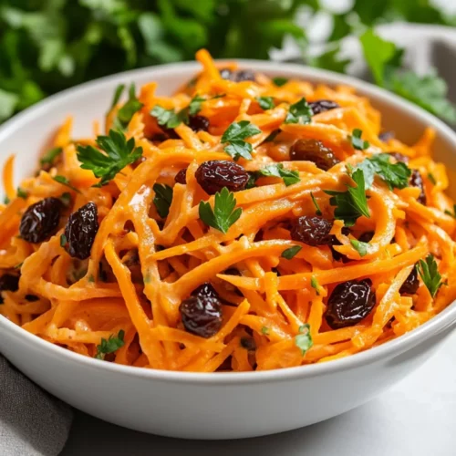 Healthy &Amp; Delicious Carrot Raisin Salad Recipe In 10 Minutes 2 Colorful Carrot Raisin Salad In A White Bowl, Garnished With Fresh Parsley And Creamy Dressing