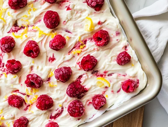 Frozen Yogurt Bark With Raspberries: A Healthy, Easy Dessert 2 Frozen Yogurt Bark With Raspberries On A White Parchment-Lined Baking Sheet, Topped With Lemon Zest.