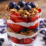 Fruit Yogurt Parfait In A Glass With Layers Of Strawberries, Greek Yogurt, And Blueberries.