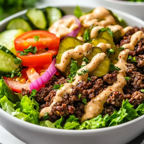 Healthy Burger Bowls With Special Sauce: A Quick &Amp; Easy Meal 2 Healthy Burger Bowls With Seasoned Beef, Fresh Vegetables, And Special Sauce On A White Plate