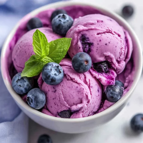 Homemade Blueberry Frozen Yogurt: Easy, Healthy &Amp; Delicious 2 Bowl Of Homemade Blueberry Frozen Yogurt Topped With Fresh Blueberries And Mint, On A Simple White Background