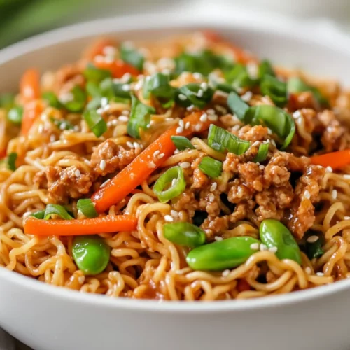Flavorful Instant Pot Ramen Stir Fry Recipe Packed With Nutritional Goodness 2 Instant Pot Ramen Stir Fry In A White Bowl, Garnished With Green Onions And Sesame Seeds
