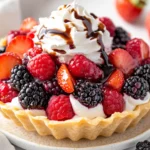 Macerated Mixed Berries Dessert Served In A Dessert Shell, Topped With Fat-Free Cool Whip And Fresh Berries