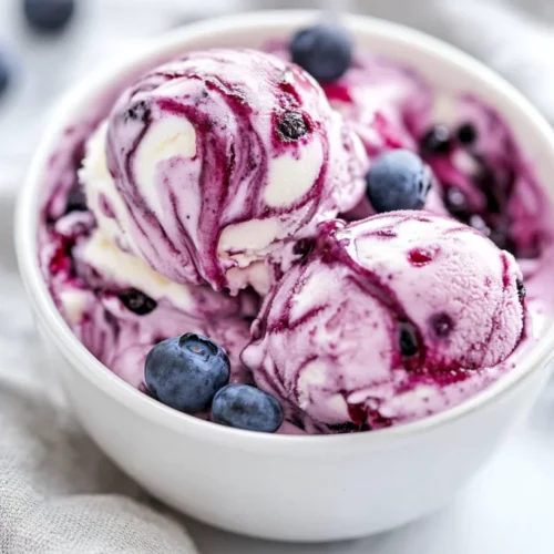 No Churn Blueberry Mascarpone Ice Cream Recipe For A Healthy Treat 2 Bowl Of No Churn Blueberry Mascarpone Ice Cream Topped With Blueberry Jam And Fresh Blueberries, Served With A Gray Kitchen Towel