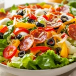 Colorful Pizza Salad In A White Bowl Featuring Fresh Veggies, Pepperoni, And Mozzarella