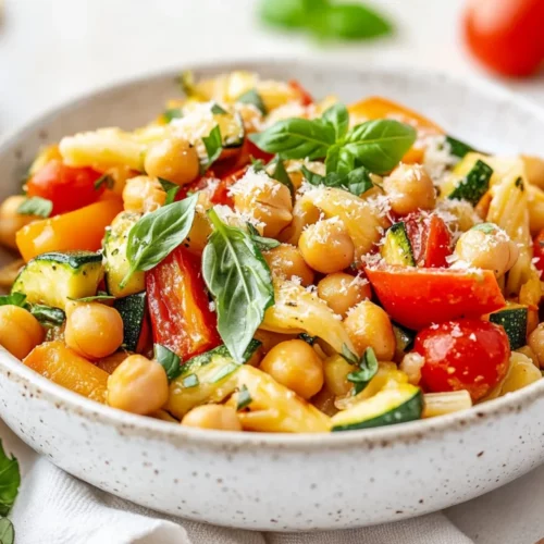 Vegan Pasta Primavera With Roasted Veggies For A Healthy Dinner 2 Bowl Of Vegan Pasta Primavera With Roasted Vegetables And Fresh Basil, Garnished With Vegan Parmesan